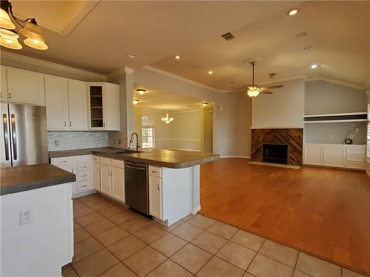 Fireplace, Interior, Kitchen, Recessed Lighting, Stainless Steel Appliances, Wood Texture Flooring