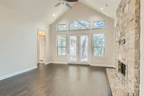 Empty room, Fireplace, Interior, Recessed Lighting, Stone Walls, Wood Texture Flooring