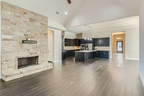 Fireplace, Interior, Kitchen, Pendant Lights, Recessed Lighting, Stainless Steel Appliances, Stone Walls, Wood Texture Flooring