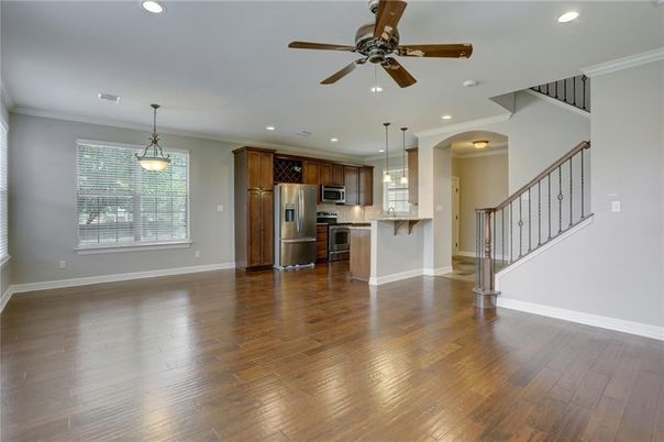 Empty room, Interior, Kitchen, Pendant Lights, Recessed Lighting, Stainless Steel Appliances, Wood Texture Flooring