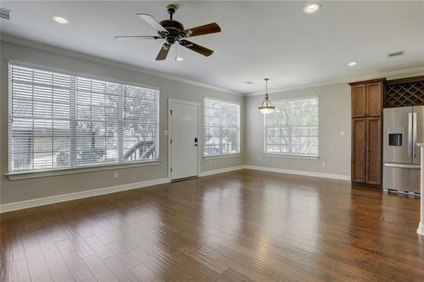 Empty room, Interior, Kitchen, Pendant Lights, Recessed Lighting, Stainless Steel Appliances, Wood Texture Flooring