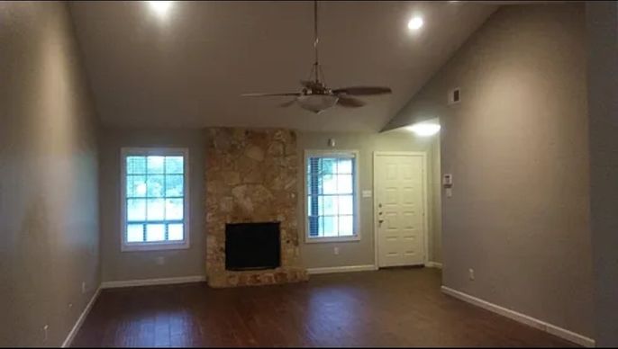 Empty room, Fireplace, Interior, Recessed Lighting, Stone Walls, Wood Texture Flooring
