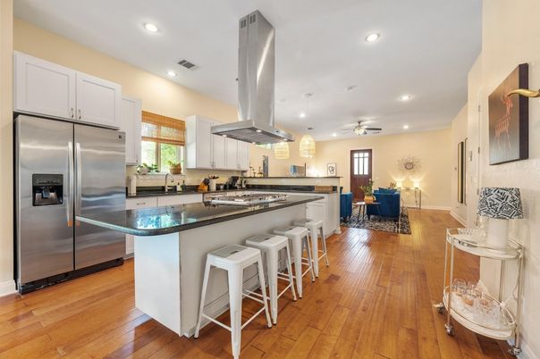 Dining room, Interior, Kitchen, Pendant Lights, Recessed Lighting, Stainless Steel Appliances, Wood Texture Flooring