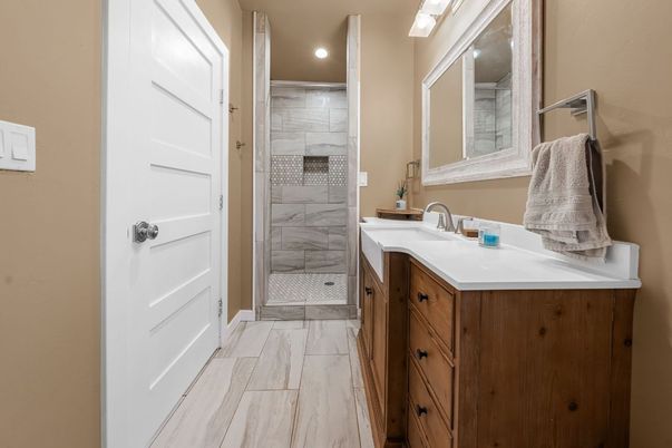 Bathroom, Dual Sink Vanities, Glass Shower, Interior, Marble, Marble Walls, Recessed Lighting