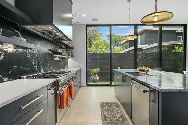 Interior, Kitchen, Marble Walls, Pendant Lights, Recessed Lighting, Stainless Steel Appliances