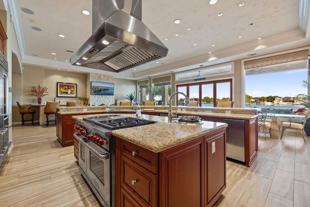 Dining room, Interior, Kitchen, Living room, Recessed Lighting, Stainless Steel Appliances, Water, Wood Texture Flooring