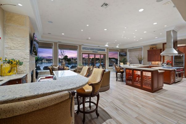 Dining room, Interior, Kitchen, Recessed Lighting, Stainless Steel Appliances, Stone Walls, Wood Texture Flooring