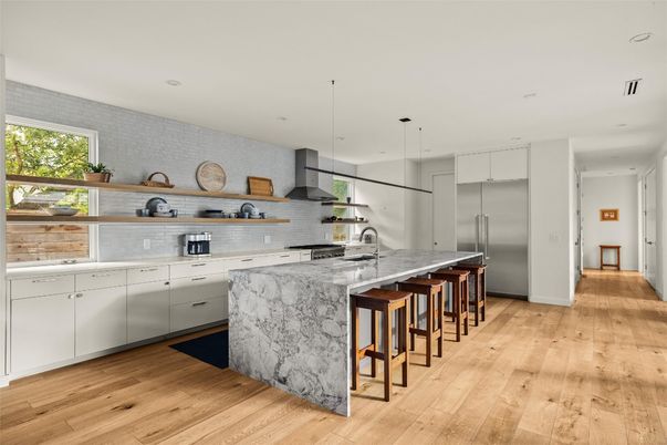 Interior, Kitchen, Marble Walls, Pendant Lights, Recessed Lighting, Stainless Steel Appliances, Wood Texture Flooring