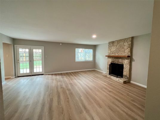 Empty room, Fireplace, Interior, Recessed Lighting, Stone Walls, Wood Texture Flooring