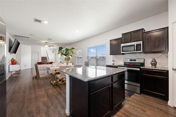 Dining room, Interior, Kitchen, Recessed Lighting, Stainless Steel Appliances, Wood Texture Flooring