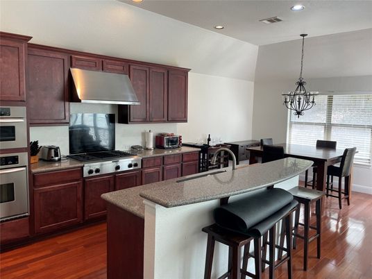 Dining room, Interior, Kitchen, Pendant Lights, Recessed Lighting, Stainless Steel Appliances, Wood Texture Flooring