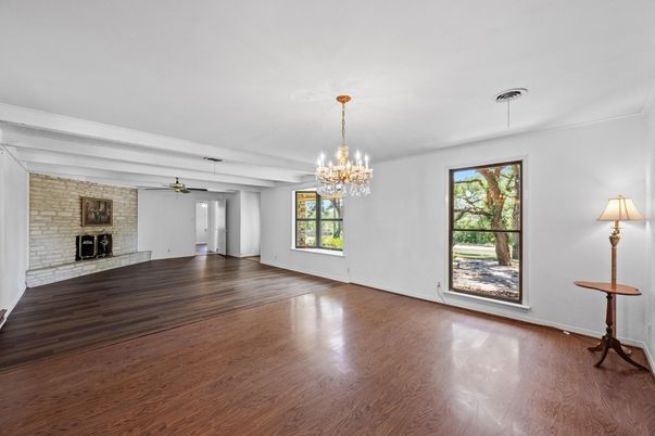 Chandelier, Empty room, Fireplace, Interior, Stone Walls, Wood Texture Flooring