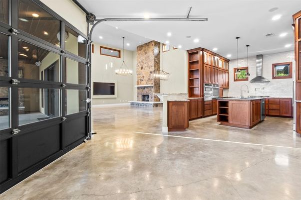 Fireplace, Interior, Kitchen, Pendant Lights, Recessed Lighting, Stainless Steel Appliances, Stone Walls