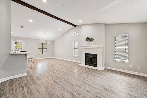 Chandelier, Empty room, Fireplace, Interior, Pendant Lights, Recessed Lighting, Wooden Beams, Wood Texture Flooring
