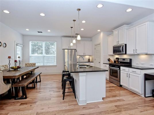 Dining room, Interior, Kitchen, Pendant Lights, Recessed Lighting, Stainless Steel Appliances, Wood Texture Flooring