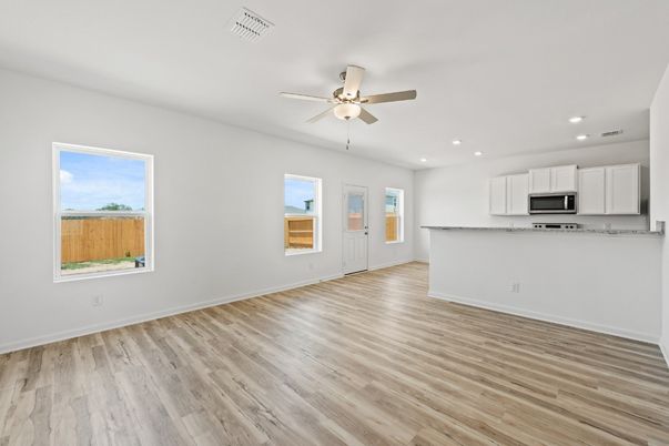 Empty room, Interior, Kitchen, Recessed Lighting, Stainless Steel Appliances, Wood Texture Flooring