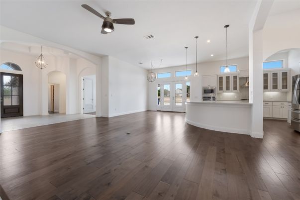 Empty room, Interior, Kitchen, Pendant Lights, Recessed Lighting, Stainless Steel Appliances, Wood Texture Flooring