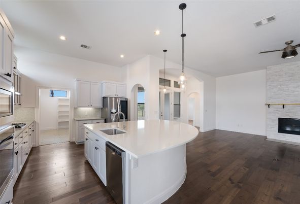 Fireplace, Interior, Kitchen, Pendant Lights, Recessed Lighting, Stainless Steel Appliances, Wood Texture Flooring