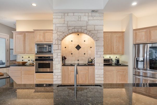 Interior, Kitchen, Recessed Lighting, Stainless Steel Appliances, Stone Walls