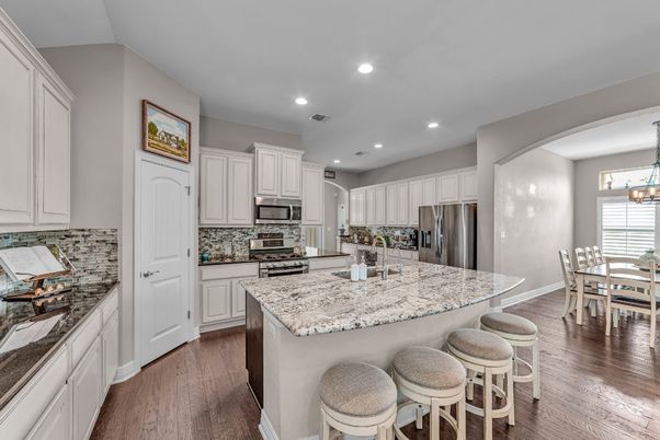 Chandelier, Dining room, Interior, Kitchen, Recessed Lighting, Stainless Steel Appliances, Wood Texture Flooring