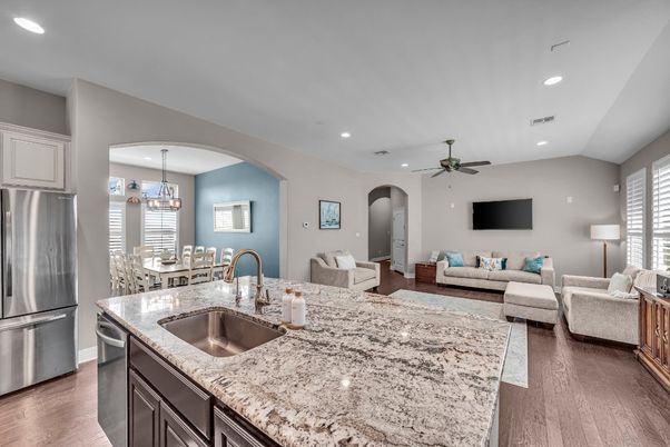 Chandelier, Dining room, Interior, Kitchen, Living room, Pendant Lights, Recessed Lighting, Stainless Steel Appliances, Wood Texture Flooring