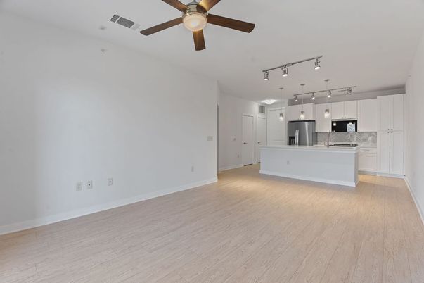 Empty room, Interior, Kitchen, Pendant Lights, Stainless Steel Appliances, Wood Texture Flooring