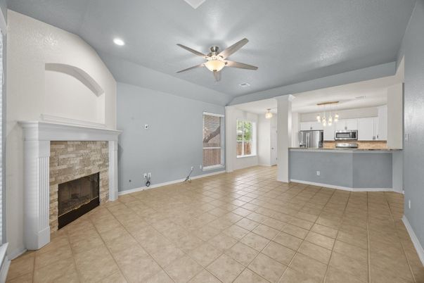 Empty room, Fireplace, Interior, Kitchen, Pendant Lights, Recessed Lighting, Stainless Steel Appliances