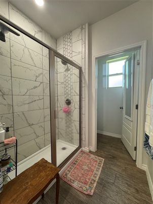 Bathroom, Glass Shower, Interior, Marble Walls, Recessed Lighting, Wood Texture Flooring