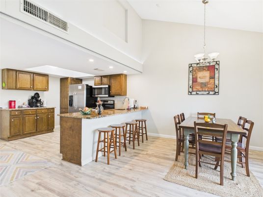 Chandelier, Dining room, Interior, Kitchen, Pendant Lights, Recessed Lighting, Stainless Steel Appliances, Wood Texture Flooring