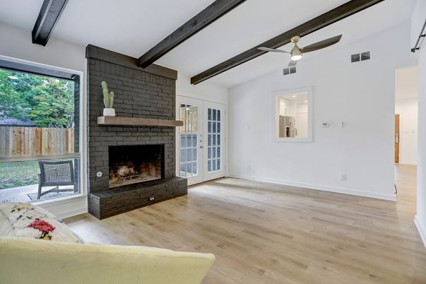 Empty room, Fireplace, Interior, Stone Walls, Wooden Beams, Wood Texture Flooring