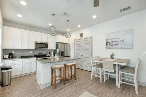 Dining room, Interior, Kitchen, Pendant Lights, Recessed Lighting, Stainless Steel Appliances, Wood Texture Flooring