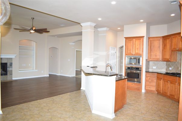 Fireplace, Interior, Kitchen, Recessed Lighting, Wood Texture Flooring