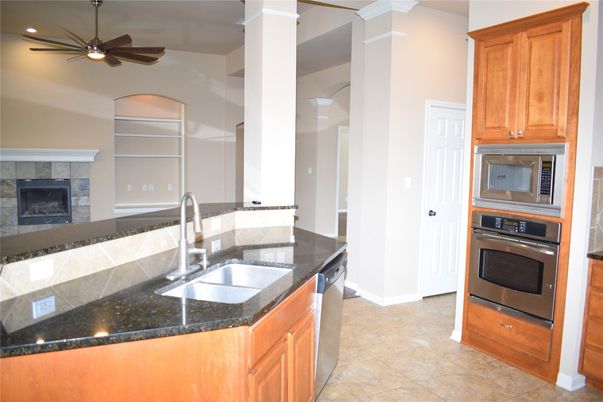 Fireplace, Interior, Kitchen, Recessed Lighting, Stainless Steel Appliances