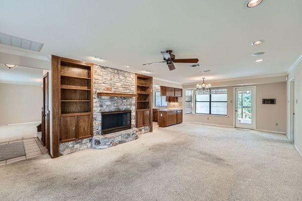 Chandelier, Empty room, Fireplace, Interior, Recessed Lighting, Stone Walls