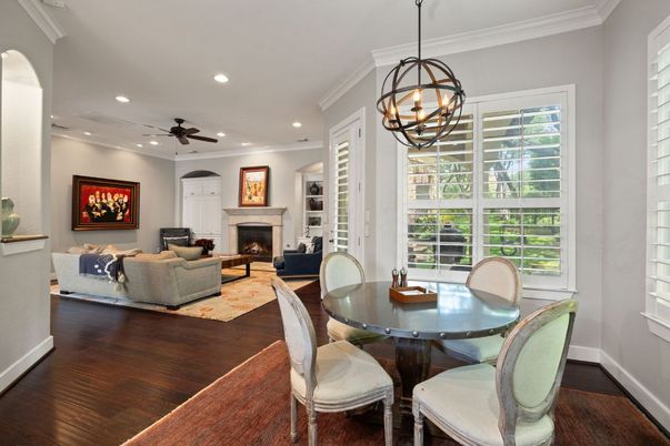 Chandelier, Dining room, Fireplace, Interior, Living room, Pendant Lights, Recessed Lighting, Wood Texture Flooring