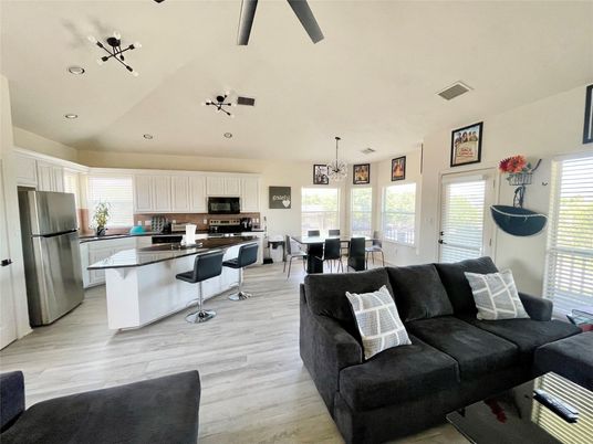 Chandelier, Dining room, Interior, Kitchen, Living room, Pendant Lights, Recessed Lighting, Stainless Steel Appliances, Wood Texture Flooring