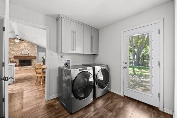Dining room, Fireplace, Interior, Recessed Lighting, Stone Walls, Washer, Wood Texture Flooring