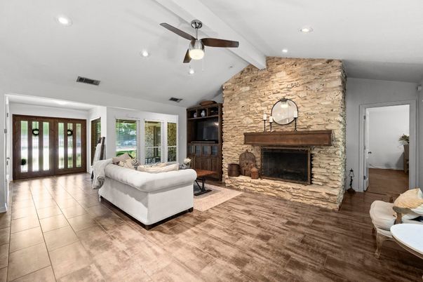 Fireplace, Interior, Living room, Recessed Lighting, Stone Walls, Wood Texture Flooring