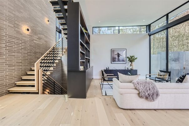 Dining room, Fireplace, Interior, Living room, Recessed Lighting, Stone Walls, Wood Texture Flooring