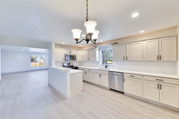 Chandelier, Interior, Kitchen, Pendant Lights, Recessed Lighting, Stainless Steel Appliances, Wood Texture Flooring