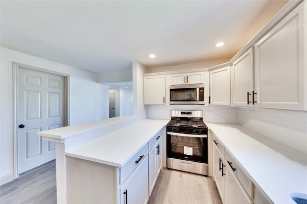Interior, Kitchen, Recessed Lighting, Stainless Steel Appliances, Wood Texture Flooring