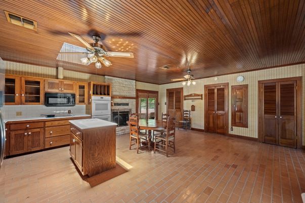 Dining room, Fireplace, Interior, Kitchen, Stainless Steel Appliances, Wooden Ceilings, Wood Texture Flooring
