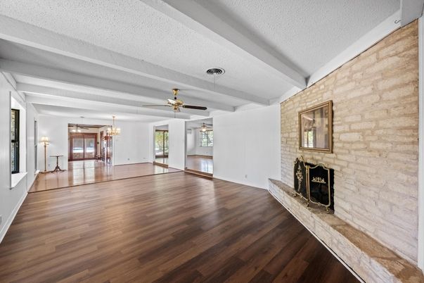 Chandelier, Dining room, Empty room, Fireplace, Interior, Stone Walls, Wood Texture Flooring