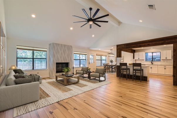 Chandelier, Dining room, Fireplace, Interior, Living room, Pendant Lights, Recessed Lighting, Wood Texture Flooring