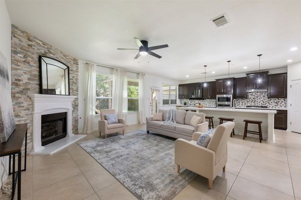 Fireplace, Interior, Kitchen, Living room, Pendant Lights, Recessed Lighting, Stainless Steel Appliances, Stone Walls