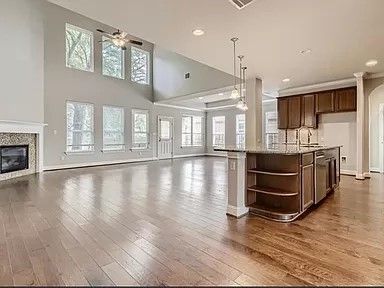 Empty room, Fireplace, Interior, Kitchen, Pendant Lights, Recessed Lighting, Wood Texture Flooring