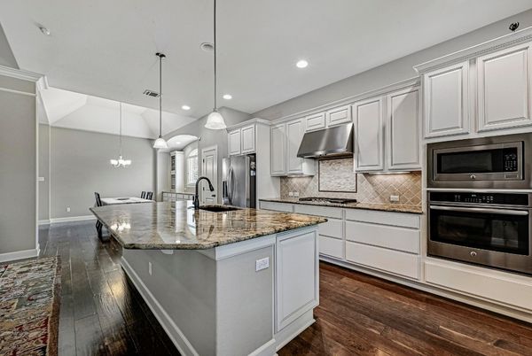 Chandelier, Dining room, Interior, Kitchen, Pendant Lights, Recessed Lighting, Stainless Steel Appliances, Wood Texture Flooring