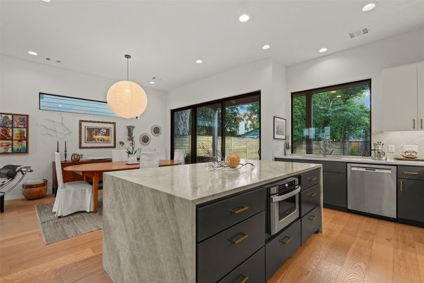 Dining room, Interior, Kitchen, Pendant Lights, Recessed Lighting, Stainless Steel Appliances, Wood Texture Flooring