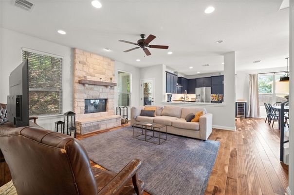 Dining room, Fireplace, Interior, Kitchen, Living room, Recessed Lighting, Stone Walls, Wood Texture Flooring