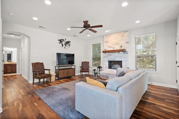 Fireplace, Interior, Living room, Recessed Lighting, Stone Walls, Wood Texture Flooring